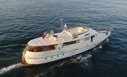 Popular event charter on a high-quality motor vessel with ageless nautical elements.