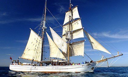Experience the traditional cargo carrying sailing ship-Soren Larsen under the beautiful blue sky.