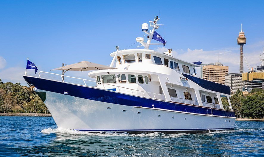 Sydney charter boat hire on a luxurious multi-level party boat .